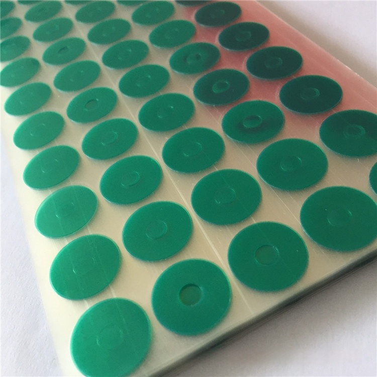 Green masking discs dots on clear liner roll