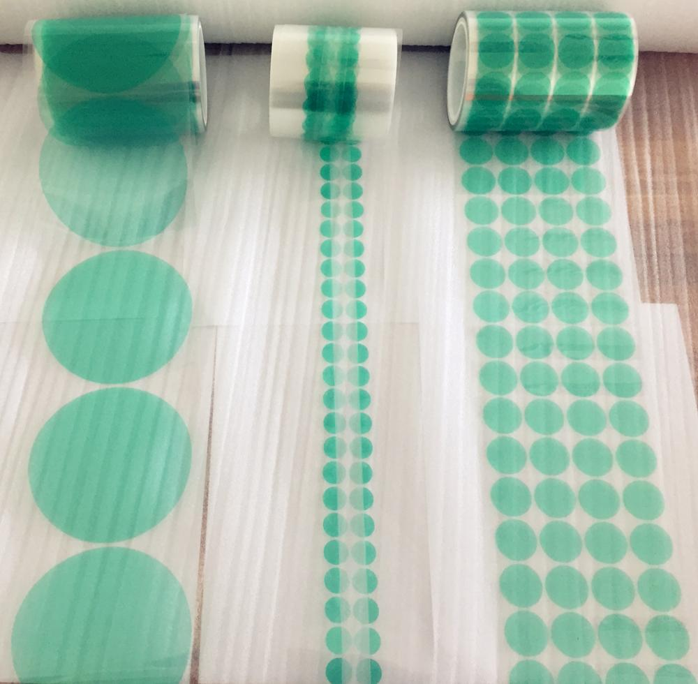 Green masking discs dots on clear liner roll