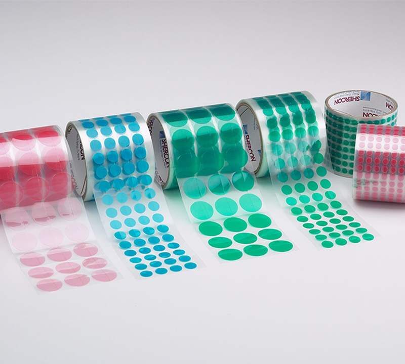 Green masking discs dots on clear liner roll